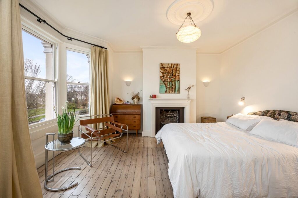 preston-drove-bathroom-bedroom-renovation-bedroom-wide-shot-bay-window-fireplace-08 Preston Drove bedroom renovation – calm scheme with bay window, fireplace and period details